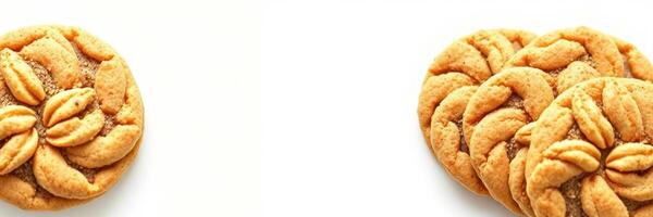 Deliciously crafted cookies with intricate designs on a clean white surface enticing sweet lovers at any time of day photo