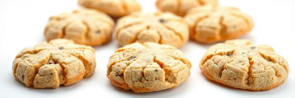 Freshly baked cookies arranged in a delightful pattern on a white surface photo