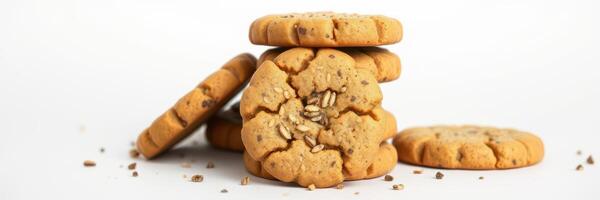 Freshly baked cookies stacked on a white background with crumbs scattered around photo