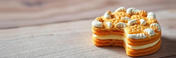 Sweet dessert with a bite taken out, showcasing intricate details on a wooden surface photo