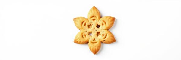 Delicious flower-shaped cookie decorated with intricate patterns on a clean white surface photo