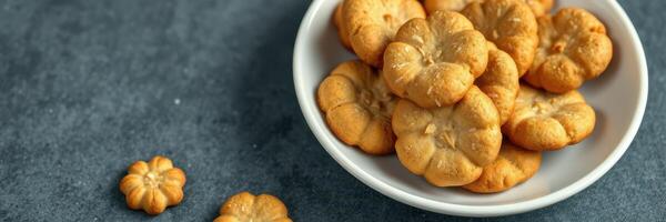 Delicious flower-shaped cookies served in a bowl, perfect for snacking or sharing at gatherings photo