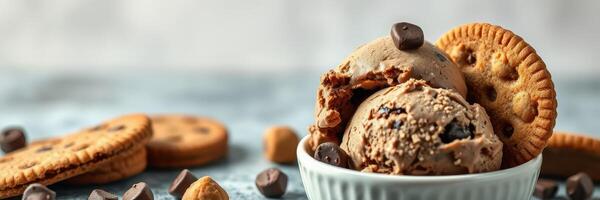 Delicious chocolate chip cookie ice cream with crunchy cookies and chocolate pieces on a light background photo