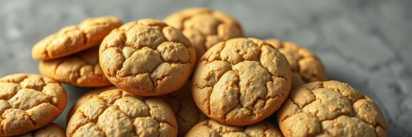 Soft and chewy cookies arranged on a light gray surface with a textured background, perfect for dessert lovers photo