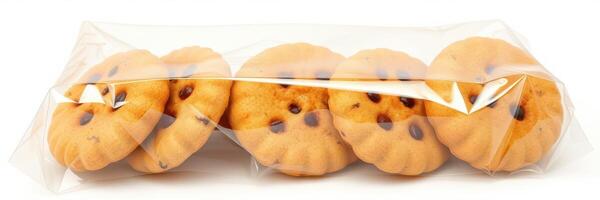 Freshly baked cookies arranged in a clear plastic wrapping on a white background photo