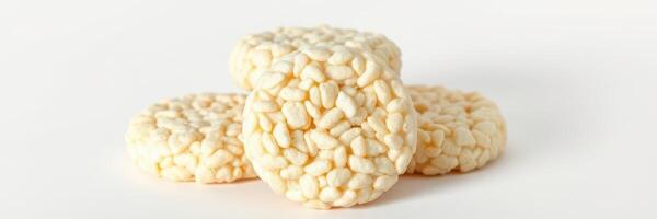 Crunchy rice cakes stacked neatly on a light background, perfect for a healthy snack or meal accompaniment photo