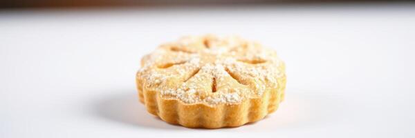 Delicious round cookie with intricate design on white surface showcasing sweet treat from a bakery photo