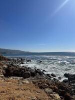 Waves crashing on shore photo