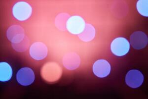 Colorful bokeh on a black background, bokeh abstract background, modern abstract backdrop. Christmas background, Xmas backdrop. Halloween scary concept, Halloween bokeh background photo