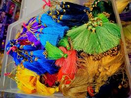 Tassels For Craft Brightly colored tassels with intricate beadwork latkan for saree blouse photo