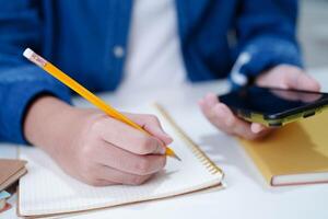 Teenage using smart phone for communication, search data internet website to learn. photo