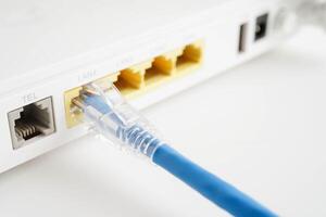 Ethernet cable with wireless router connect to internet service provider network. photo