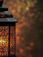 Elegant middle eastern lantern with intricate patterns illuminated at night photo