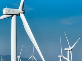 Wind energy and sustainable power generation with wind turbines, Eco-friendly solutions for renewable resources. Wind power farm and sustainable development of renewable energy, green technology. photo