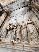 Padua, Italy - July 04, 2022 Intricate marble sculpture depicting ancient Roman figures in a historic setting. photo