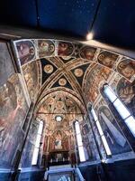 Padua, Italy - July 04, 2022 Intricate frescoes on historic chapel interior ceiling and walls. photo