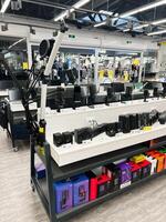 Kyiv, Ukraine - December 15, 2024 Retail display of audio and computer accessories in a modern electronics store photo