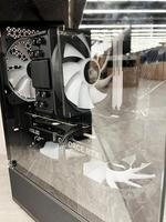 Kyiv, Ukraine - December 15, 2024 Modern desktop gaming PC with visible internal components through the side panel photo