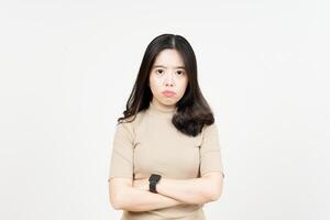 Folding arms with Angry Face Expression Of Beautiful Asian Woman Isolated On White Background photo