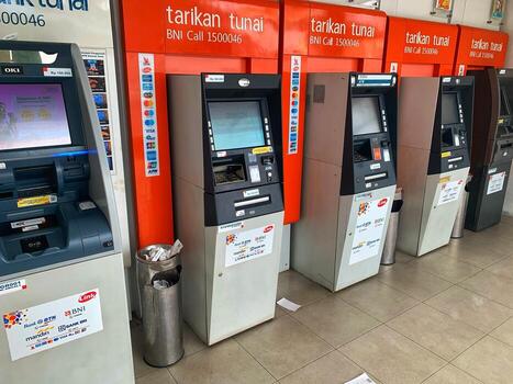 Several BNI ATM machines lined up in a row. Indonesia - Sibolga, December 12, 2024 photo