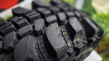 detailed image of a brand new car tire showcasing its intricate tread pattern for enhanced grip and performance photo