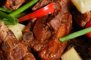 a close up of a plate of meat and vegetables photo