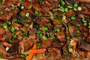 a plate of food with meat and vegetables photo