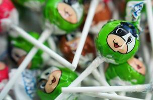 a bunch of lollipops with cartoon characters on them photo