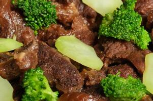 a close up of a plate of beef and broccoli photo