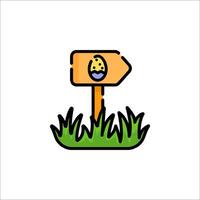 A sign with an egg on it in the grass vector