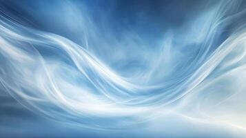 Blue sky with white clouds and a blue wave. The sky is very clear and the clouds are scattered throughout. The wave is very large and it seems to be moving towards the right side of the image photo