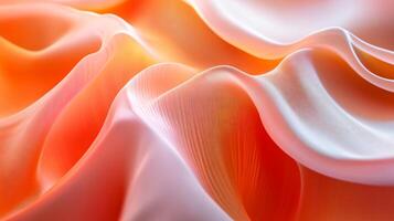 The image is of a piece of fabric with a wave pattern. The fabric is orange and white, and the wave pattern is very detailed. The image has a dreamy, ethereal quality to it photo