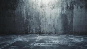 Large, empty room with a concrete wall. The room is bare and empty, with no furniture or decorations. The wall is covered in graffiti and has a rough, unfinished appearance. The room has a cold photo