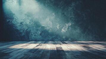 Dark room with a wooden floor and a wall with a blue paint. The room is empty and has a very dark and moody atmosphere photo