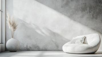 White room with a white couch and a white vase. The room is empty and has a minimalist feel photo