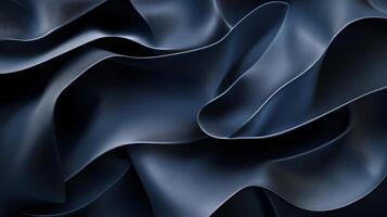 The image is a close up of a piece of fabric with a blue hue. The fabric is folded and has a wavy texture, giving it a sense of movement and depth photo