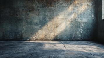 Large empty room with a wall that is covered in cracks and has a grey color. The room is very bare and empty photo