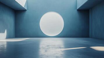 Large, circular window in a room with a blue wall. The window is the only source of light in the room photo