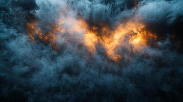 The image is of a stormy sky with a lot of smoke and fire. The sky is dark and the clouds are thick, giving the impression of a powerful and dangerous storm photo