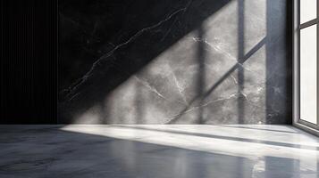 Large, empty room with a window and a wall with a pattern. The room is very dark and the window is letting in a lot of light photo