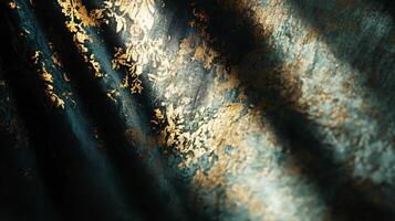 Piece of gold and black fabric with a shiny, reflective surface. The fabric is draped over a surface, creating a sense of movement and depth. The gold and black colors create a sense of luxury photo