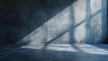 Large empty room with a window that is letting in sunlight. The room is mostly grey and has a very minimalistic feel to it photo
