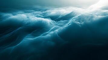 The image is of a blue ocean with waves crashing against the shore. The water is choppy and the sky is clear, creating a serene and peaceful atmosphere photo