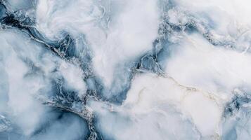Blue and white marble wall with a pattern of swirls and lines. The marble is shiny and reflective, giving the wall a sense of depth and texture photo