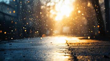 Blurry image of a wet road with raindrops and a sun in the background. Scene is serene and peaceful, as the raindrops create a calming effect and the sun adds a warm glow to the scene photo