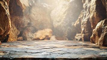 Rocky cave with a large opening. The cave is empty and the light is shining through the opening photo