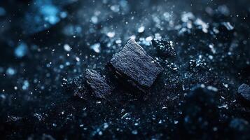 Close up of a pile of rocks with a blue background. The rocks are scattered and appear to be broken into pieces. Scene is somber and desolate, as the rocks seem to be abandoned and forgotten photo