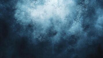 The sky is a deep blue color with white clouds scattered throughout. The background is also blue, creating a serene and peaceful atmosphere photo