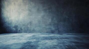 Large empty room with a grey wall. The room is empty and has a very cold and empty feeling photo