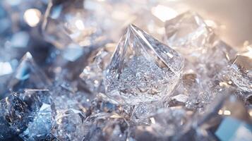 Close up of a pile of ice cubes. The ice cubes are all different sizes and shapes, but they all have a similar, clear appearance. Concept of coldness and stillness photo